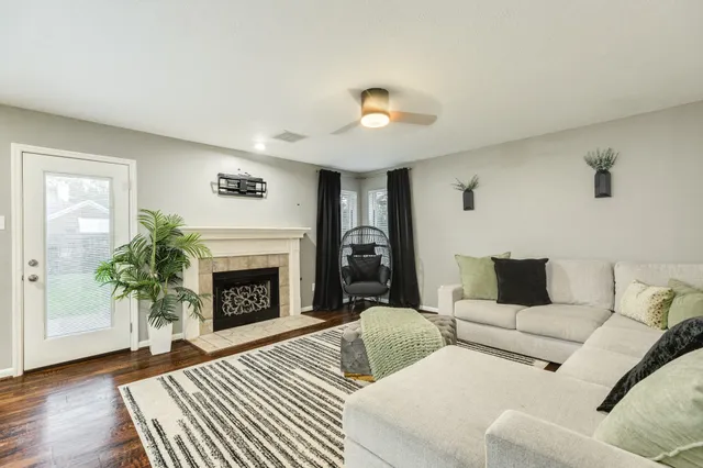 a living room with furniture and a fireplace