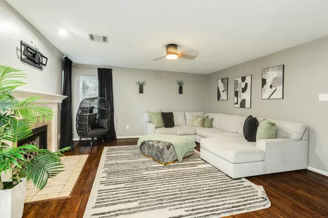 a living room with furniture and a rug