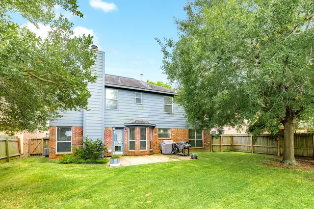 a view of a house with a yard porch and sitting area