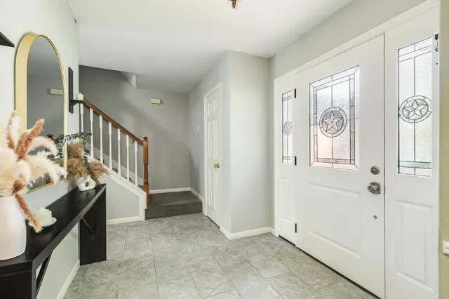 a view of an entryway door front of a house