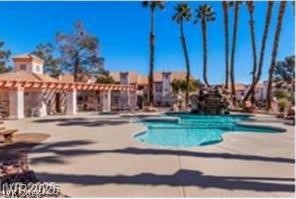 7570 West Flamingo Road, Unit 125 Las Vegas, NV 89147 - Photo 15 of 29 Community pool with a pergola, a patio area, and a jacuzzi