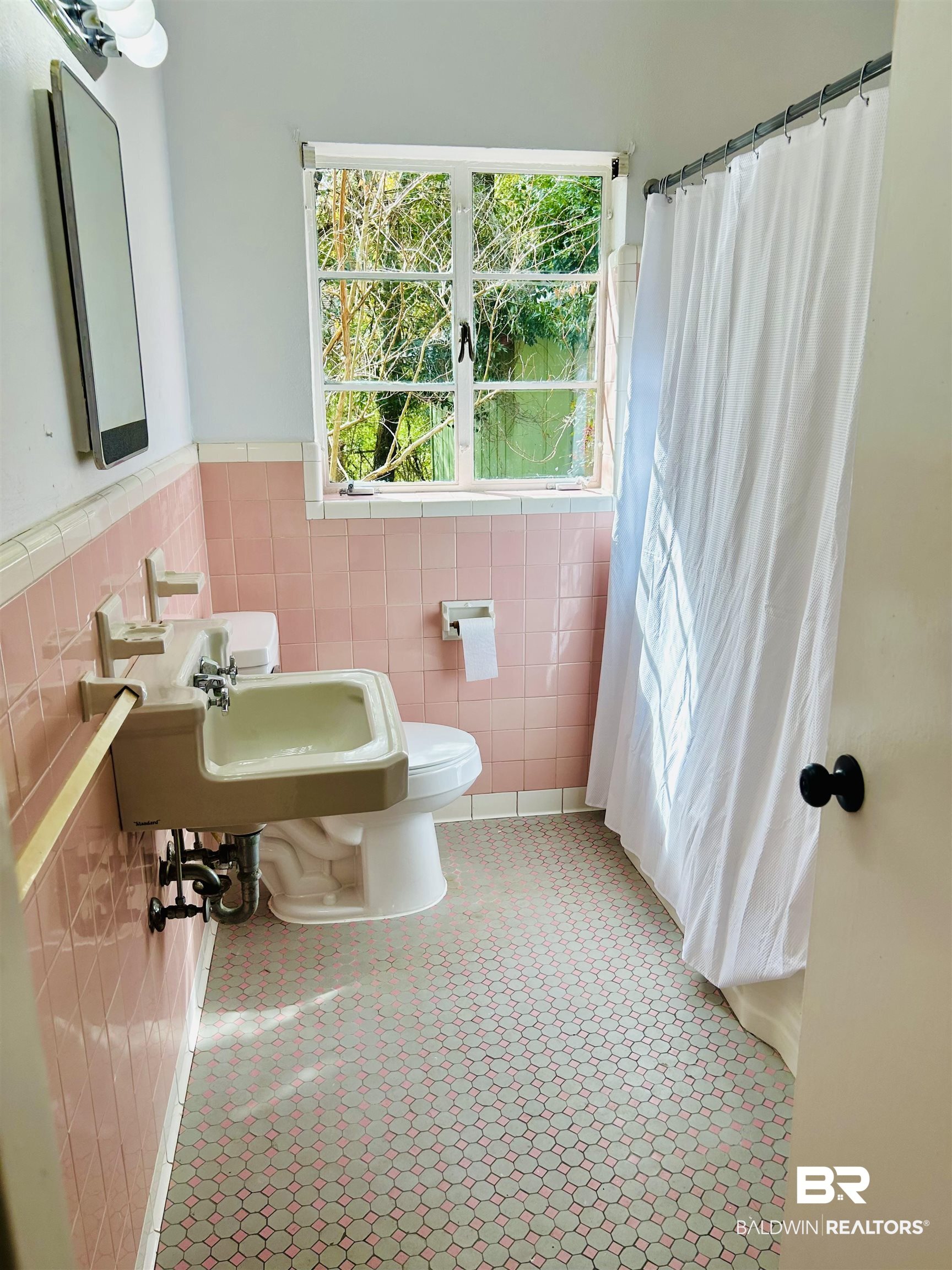 94 Diamond Street Mobile, AL 36611 - Photo 17 of 30 Bathroom featuring tile walls, a shower with shower curtain, and toilet