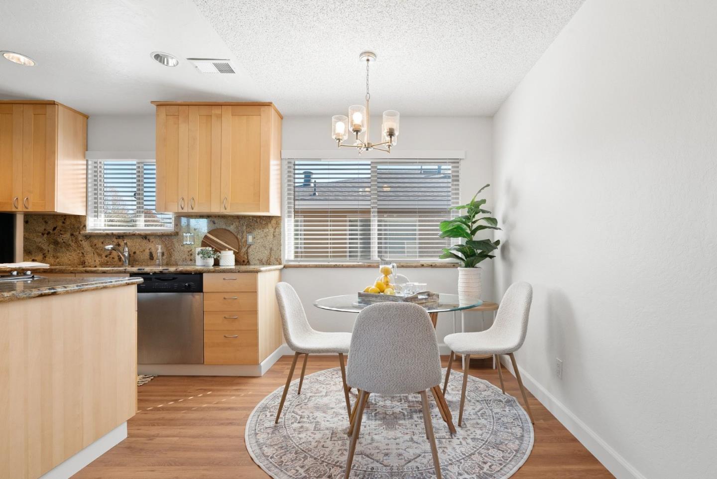4465 Diamond Street, Unit 4 Capitola, CA 95010 - Photo 13 of 41 a view of a dining room with furniture and wooden floor