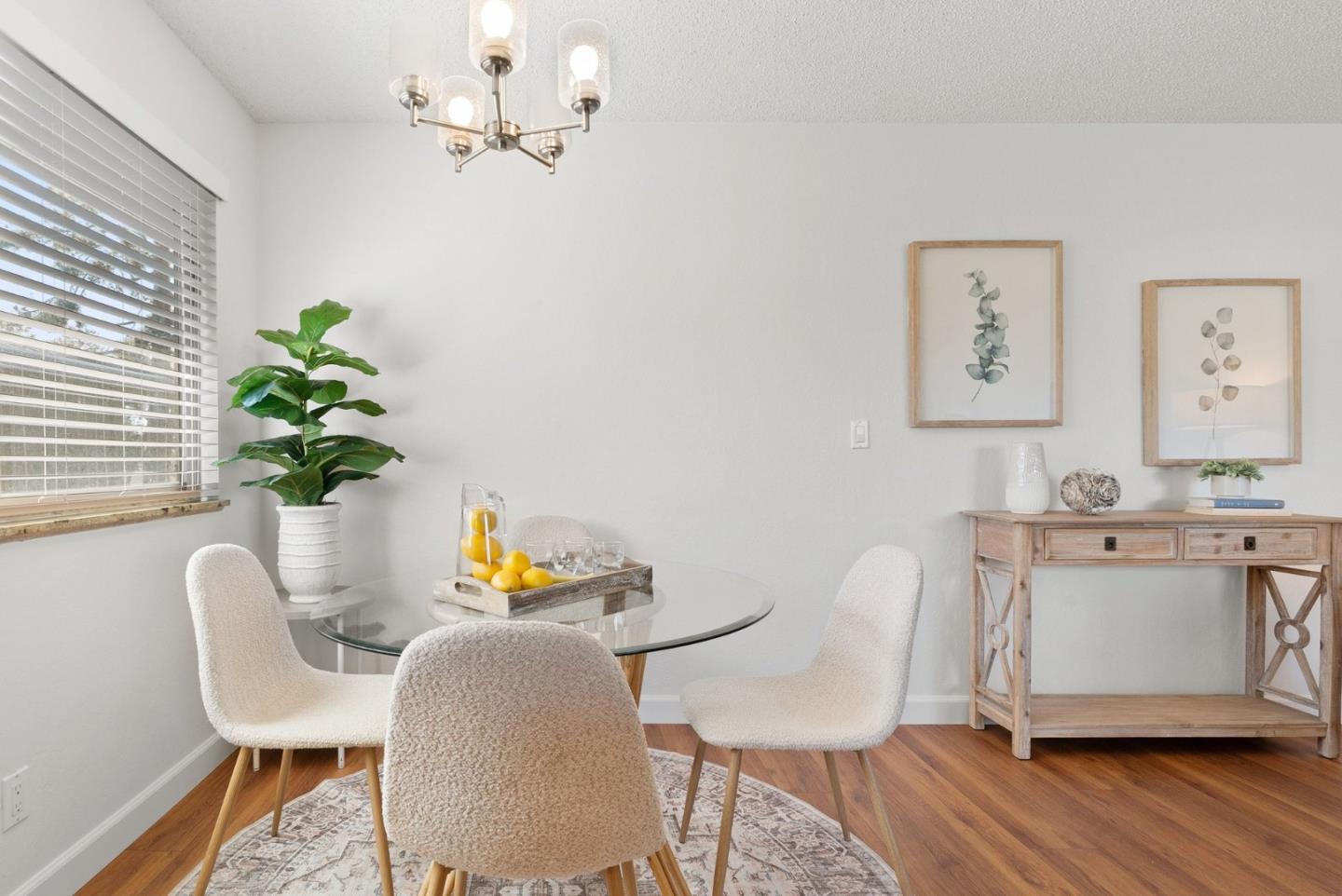 4465 Diamond Street, Unit 4 Capitola, CA 95010 - Photo 15 of 41 a dining room with furniture potted plants and wooden floor