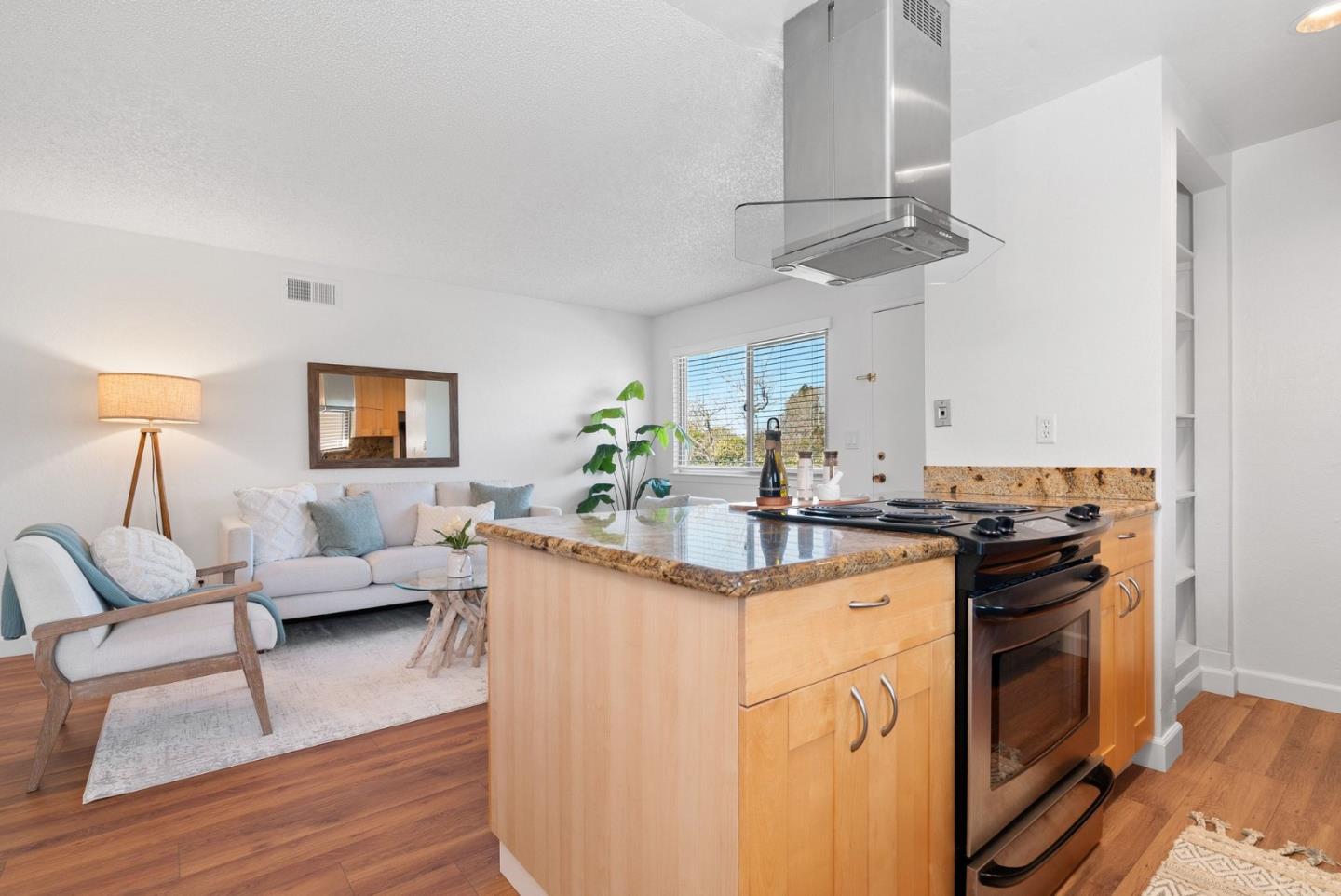 4465 Diamond Street, Unit 4 Capitola, CA 95010 - Photo 16 of 41 a kitchen with a sink cabinets and wooden floor