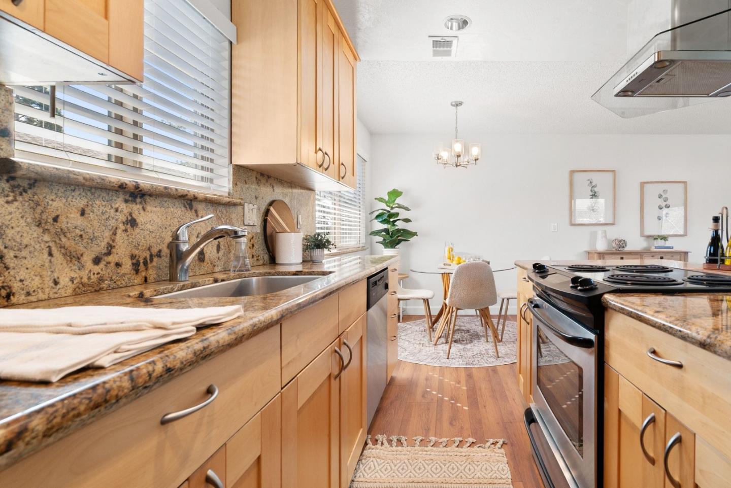 4465 Diamond Street, Unit 4 Capitola, CA 95010 - Photo 19 of 41 a kitchen with a sink stove and cabinets