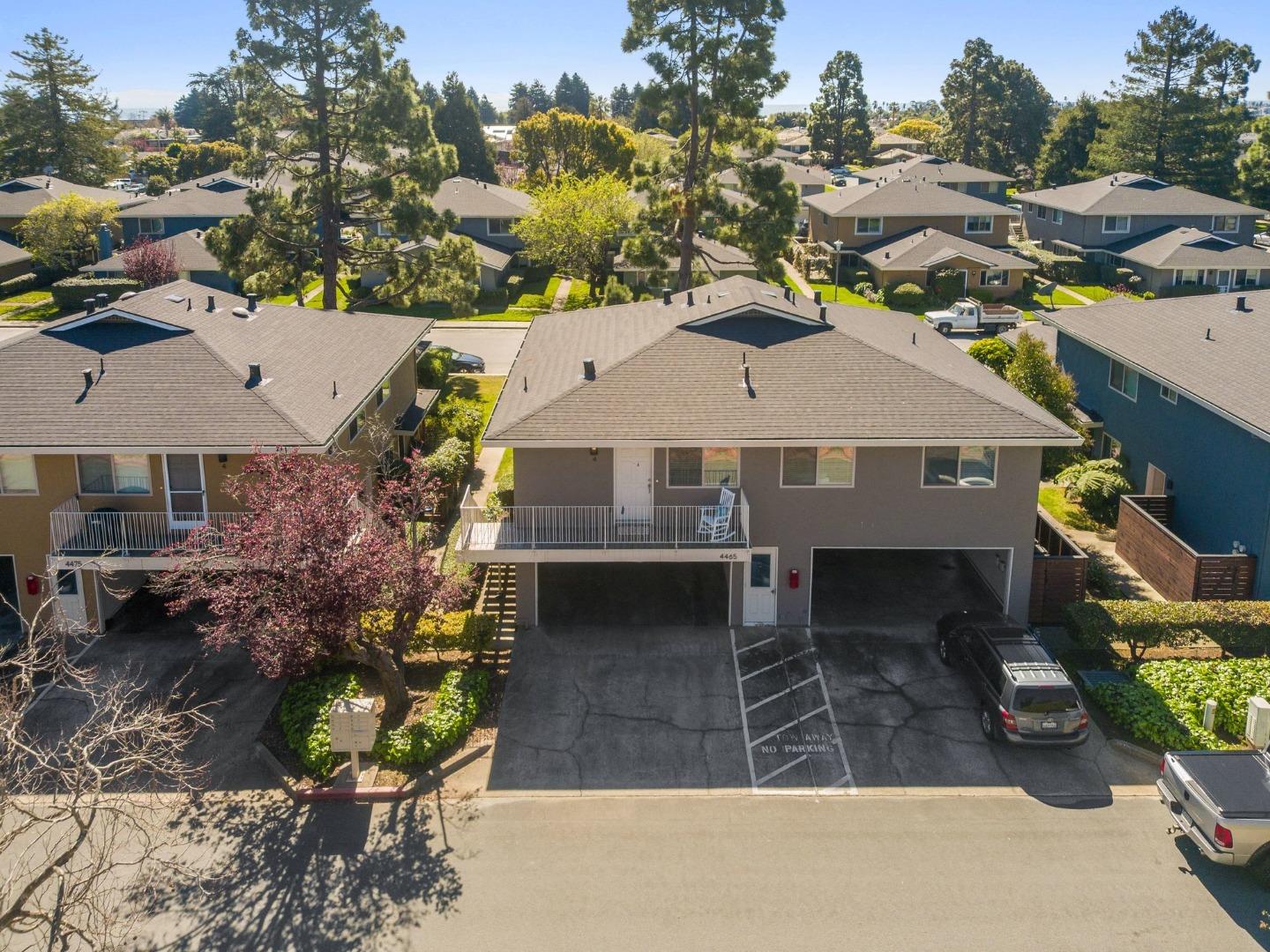 4465 Diamond Street, Unit 4 Capitola, CA 95010 - Photo 36 of 41 a aerial view of a house with a garden and plants