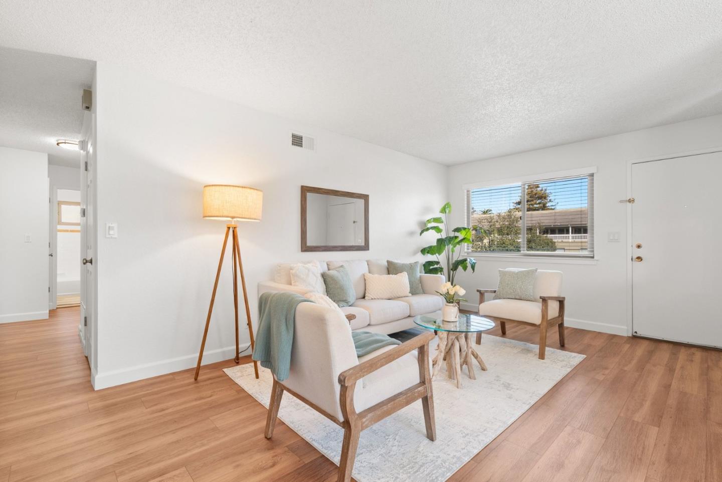 4465 Diamond Street, Unit 4 Capitola, CA 95010 - Photo 6 of 41 a living room with furniture and a wooden floor