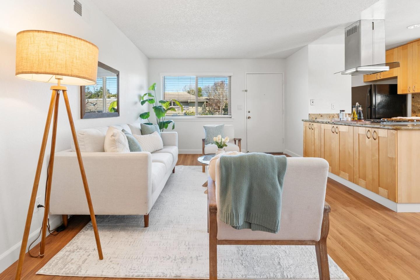 4465 Diamond Street, Unit 4 Capitola, CA 95010 - Photo 7 of 41 a living room with furniture and a flat screen tv