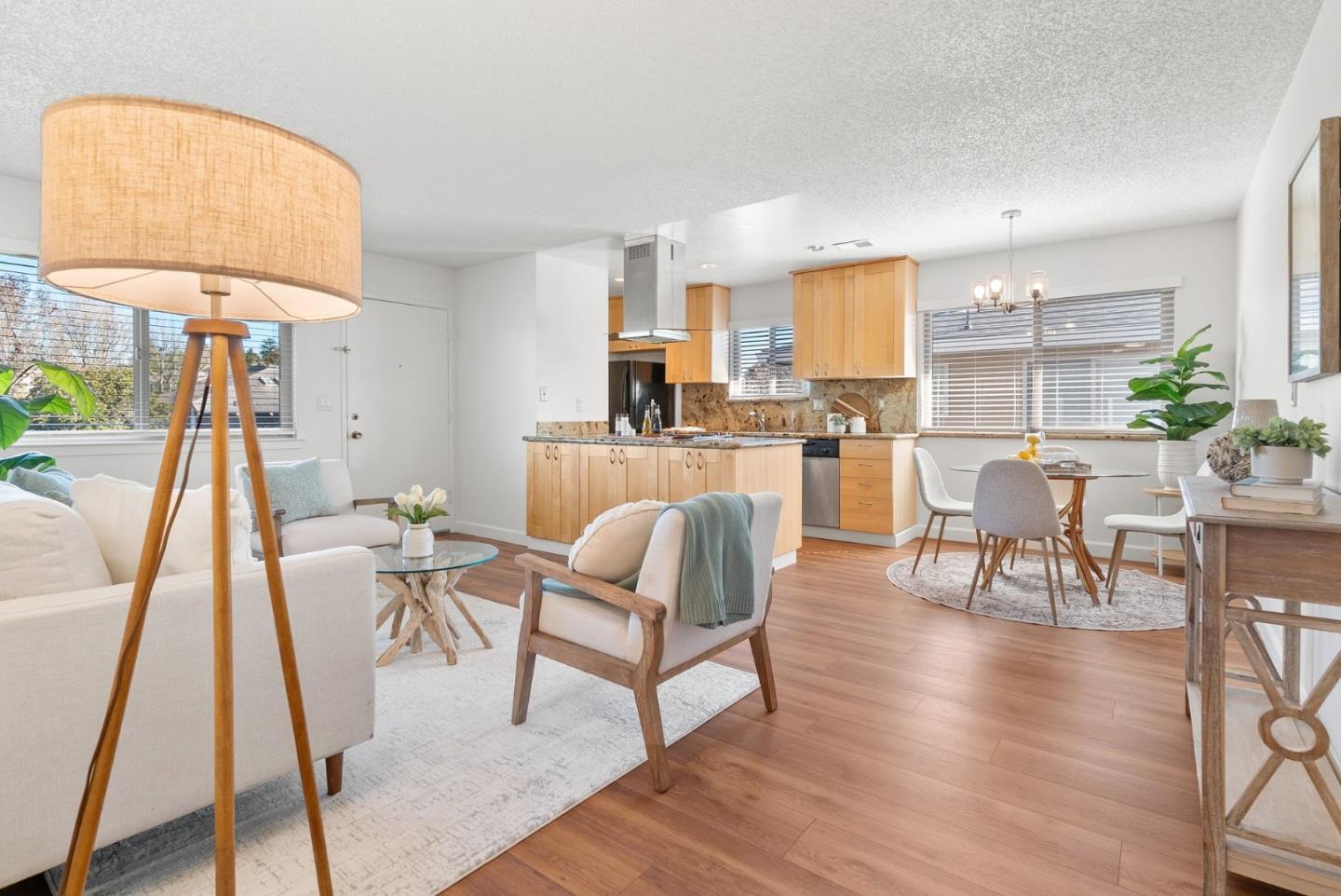 4465 Diamond Street, Unit 4 Capitola, CA 95010 - Photo 8 of 41 a living room with furniture a dining table and a potted plant