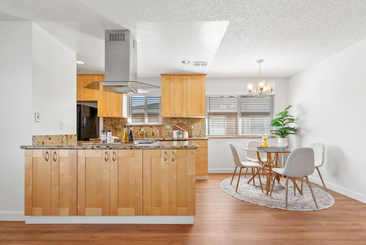 4465 Diamond Street, Unit 4 Capitola, CA 95010 - Photo 10 of 41 a dining room with furniture and wooden floor