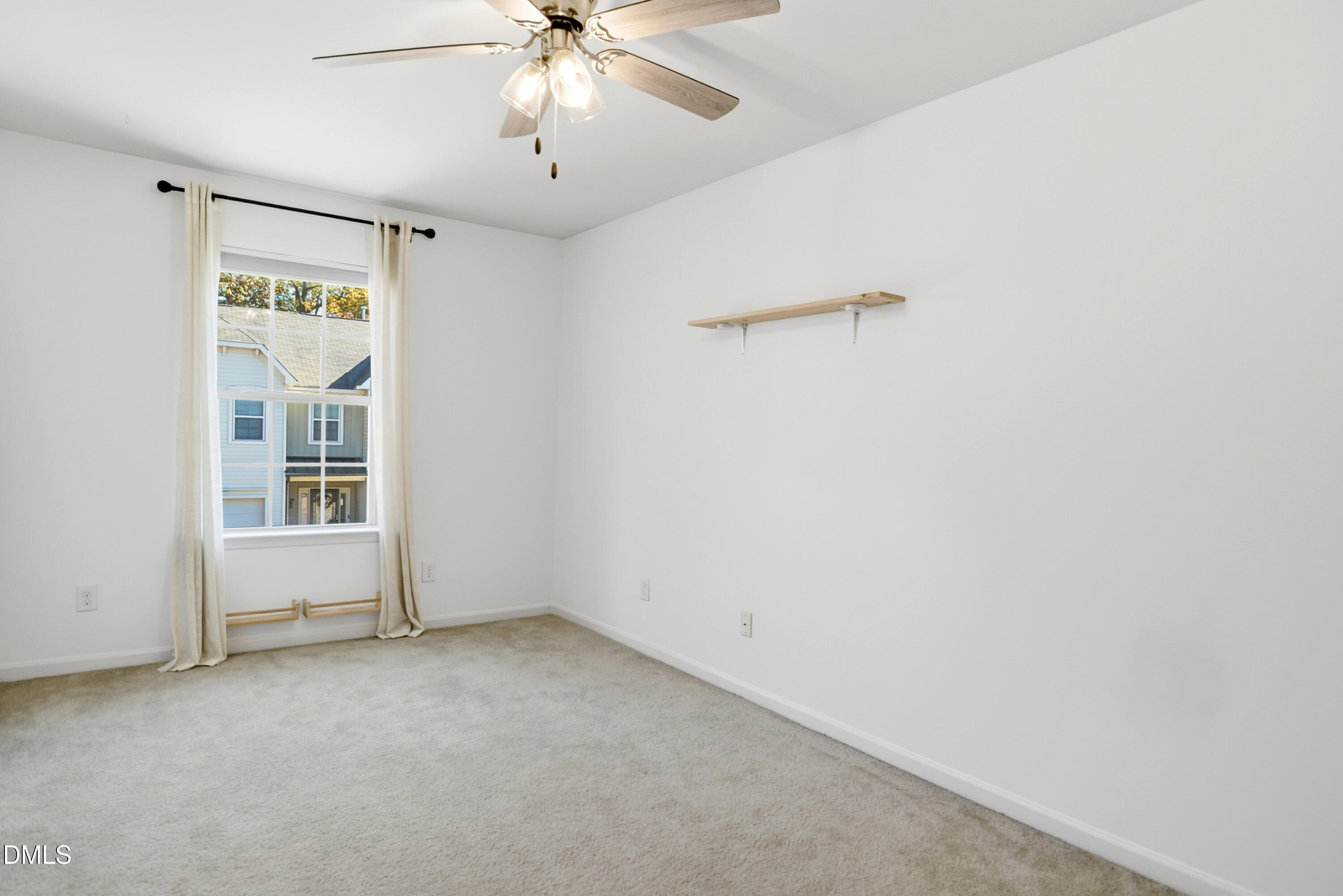 2700 Benevolence Drive Raleigh, NC 27610 - Photo 13 of 18 an empty room with windows and fan