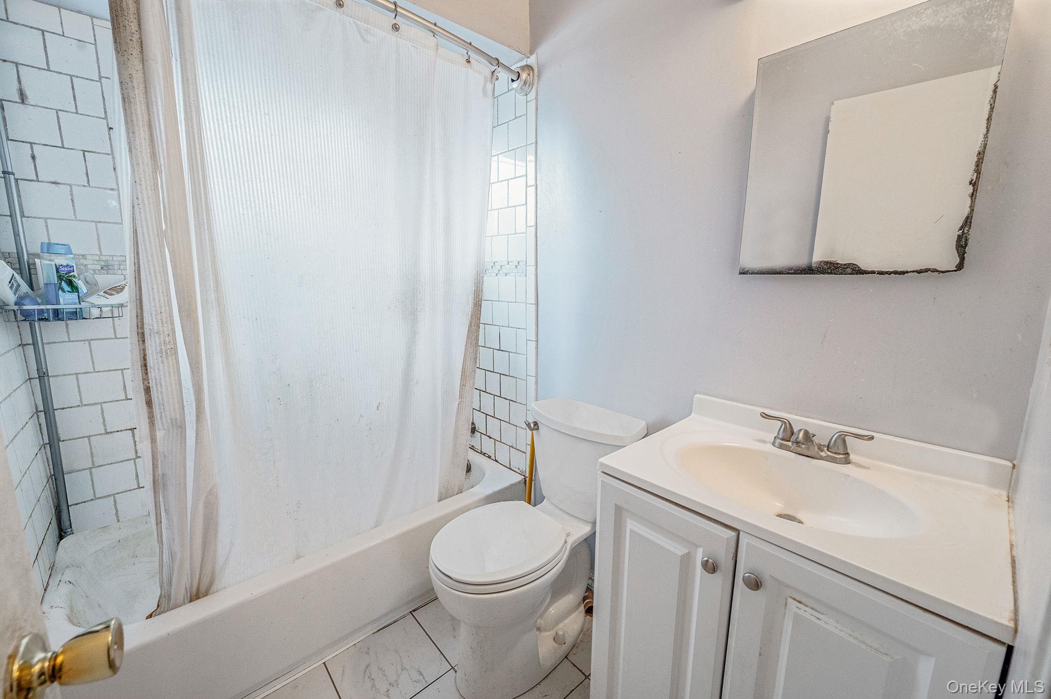 194 Central Park Road Plainview, NY 11803 - Photo 16 of 19 Bathroom featuring vanity and shower / tub combo