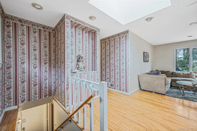 a bedroom with furniture window and wooden floor