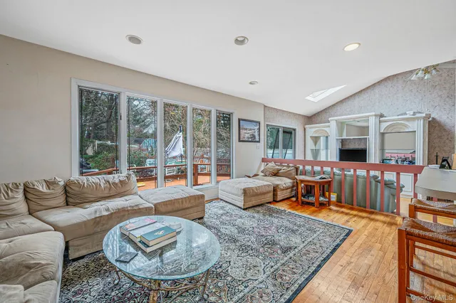a living room with furniture and a table