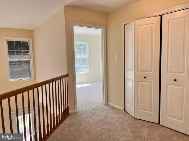 a view of a hallway with closet area