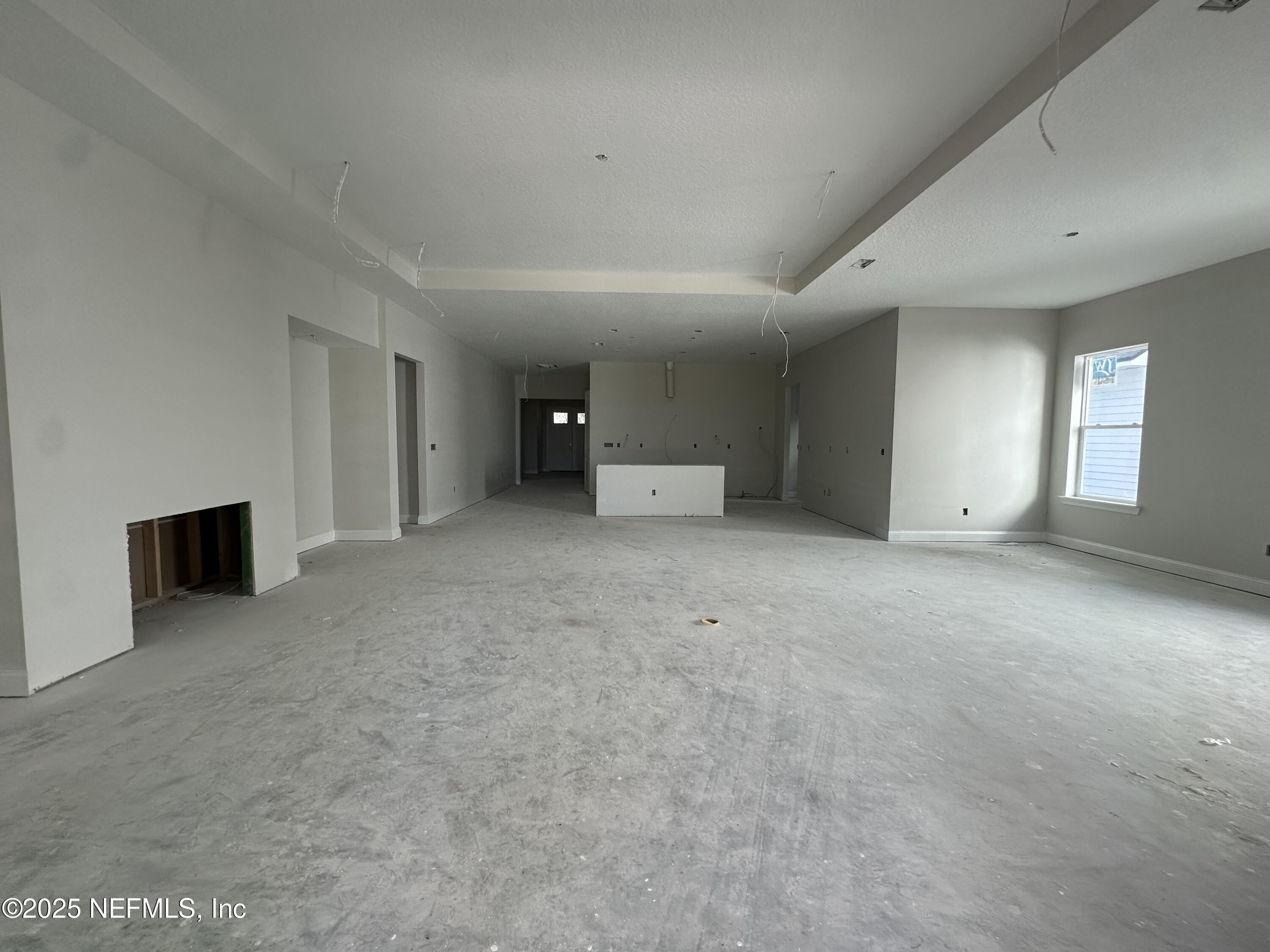 118 Historic Brick Lane St. Augustine, FL 32095 - Photo 14 of 36 a view of an empty room with a fireplace