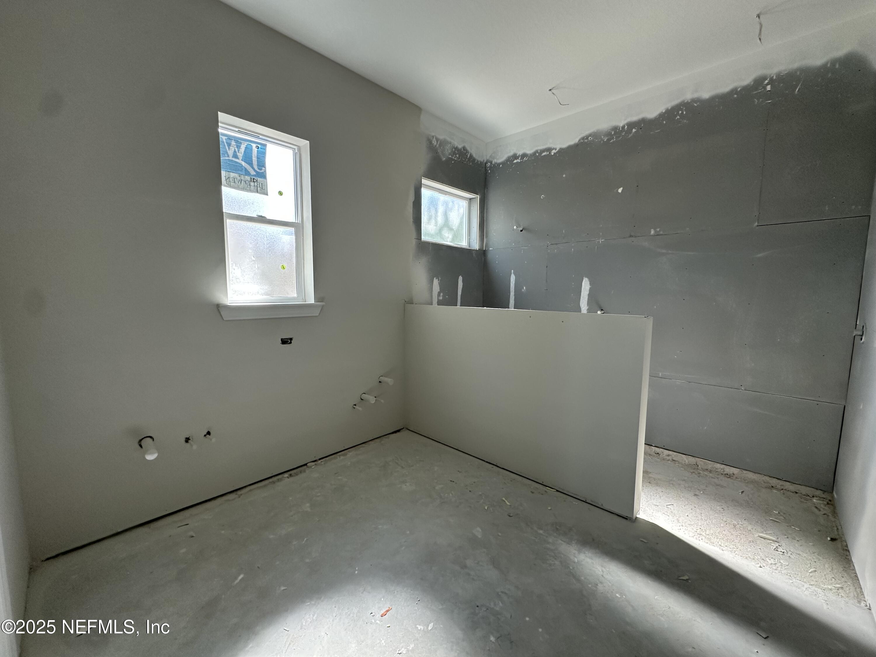 118 Historic Brick Lane St. Augustine, FL 32095 - Photo 18 of 36 an empty room with windows