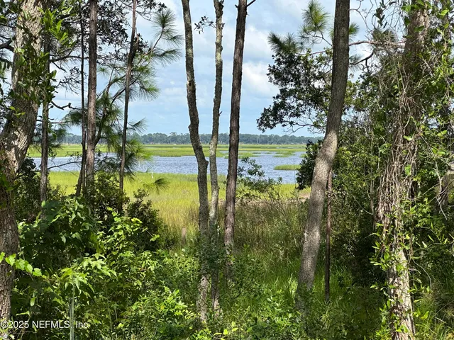 a view of an empty room with wooden walls