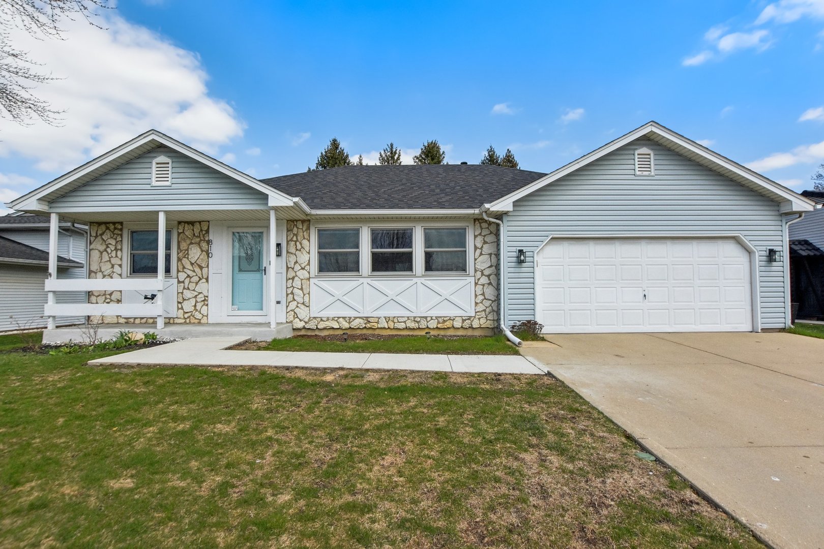 a view of a house with swimming pool and a yard