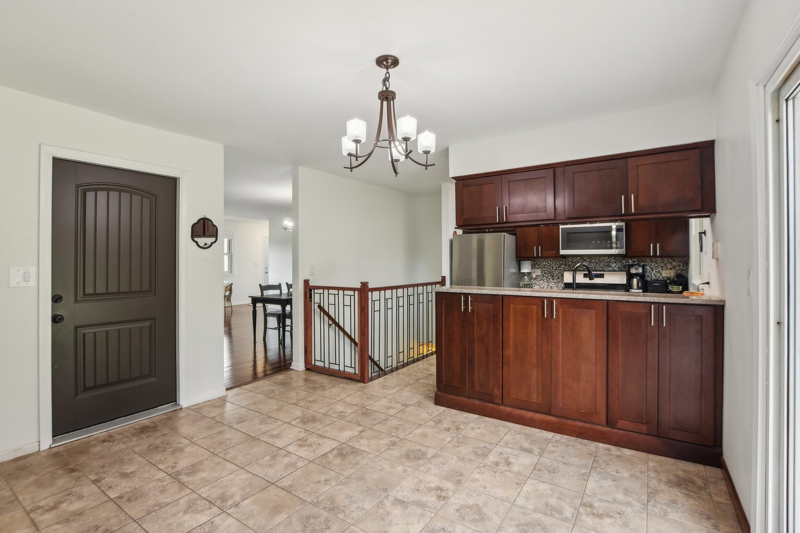 810 Case Drive Roselle, IL 60172 - Photo 8 of 34 a view of kitchen with stainless steel appliances granite countertop wooden cabinets a refrigerator and a sink