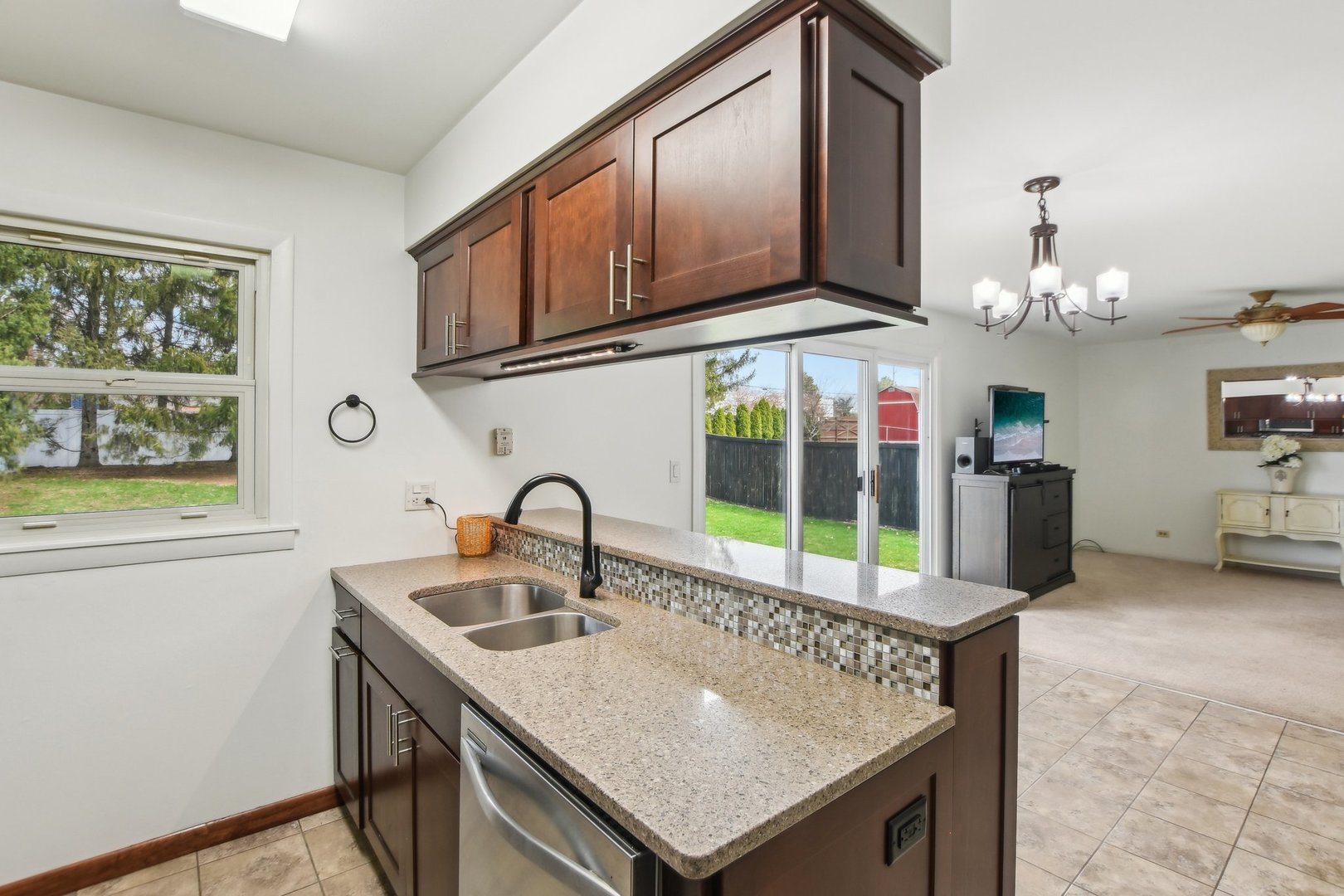 810 Case Drive Roselle, IL 60172 - Photo 10 of 34 a kitchen with a sink a stove and cabinets