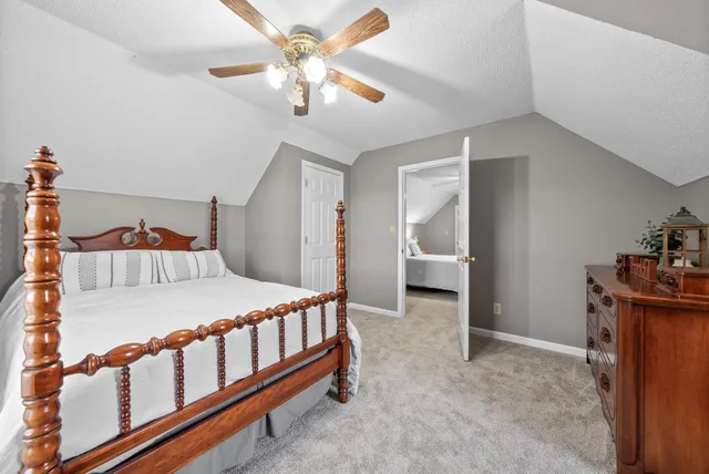 a bedroom with furniture and a chandelier