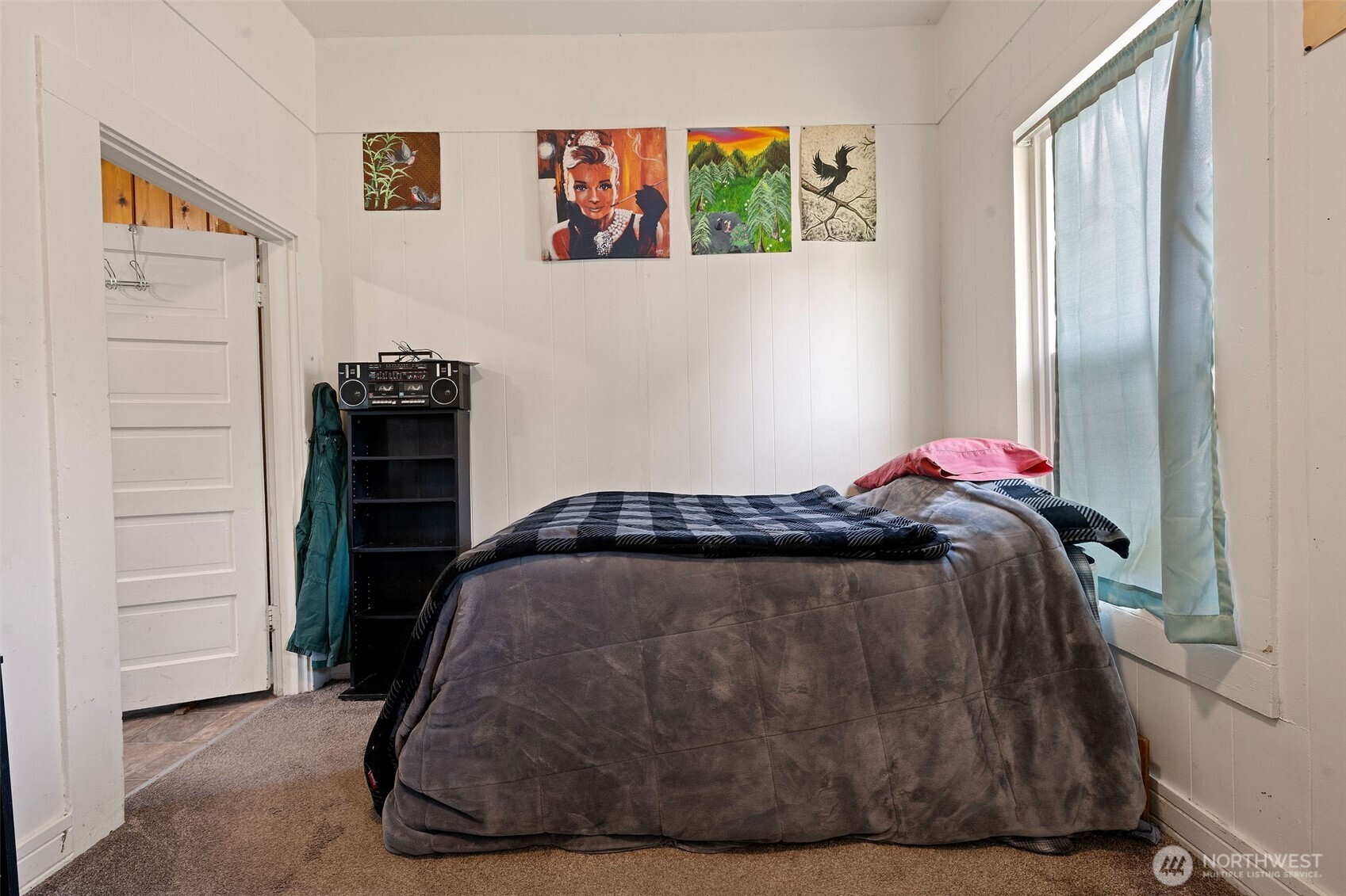 1218 Cedar Street Raymond, WA 98577 - Photo 13 of 31 a bedroom with a bed and a window