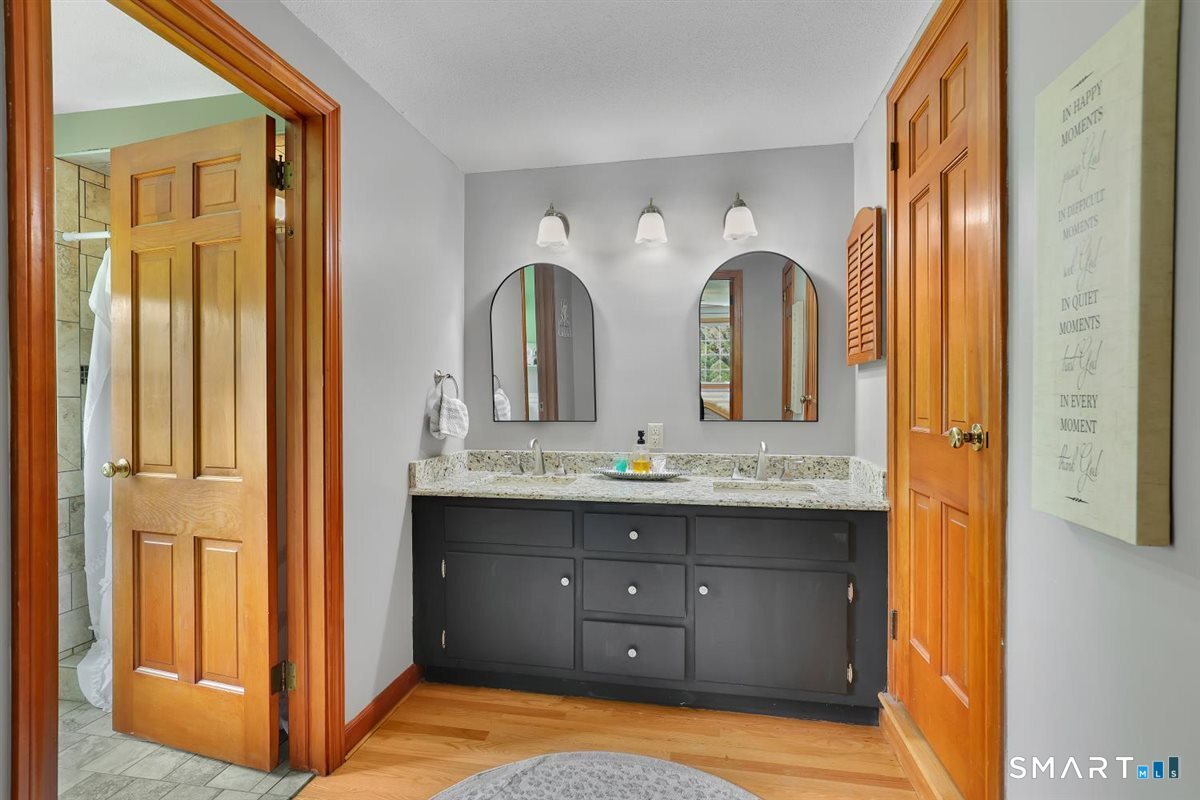72 Old Post Road Wethersfield, CT 06109 - Photo 19 of 40 a bathroom with a double vanity sink and a mirror