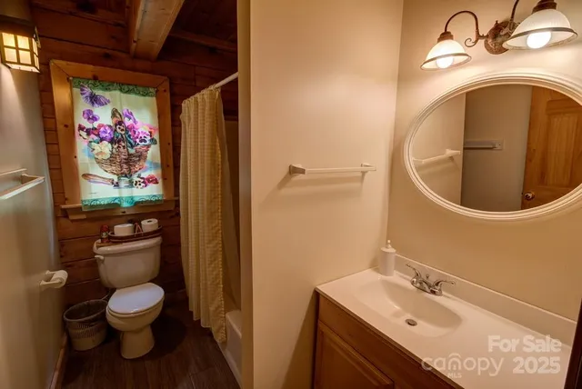 a bedroom with bed and a night stand