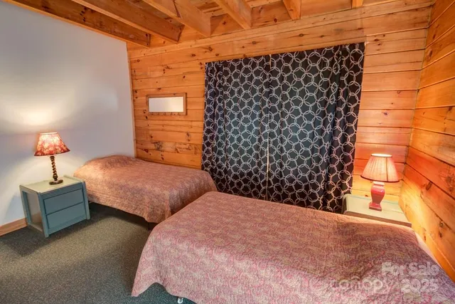 a bedroom with bed and a window