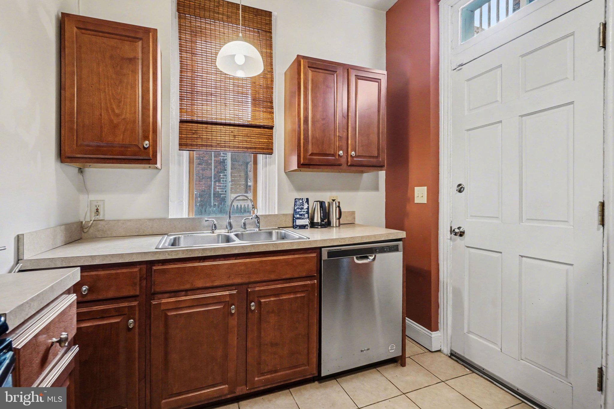261 Delaware Street Harrisburg, PA 17102 - Photo 11 of 40 a kitchen with a sink and cabinets