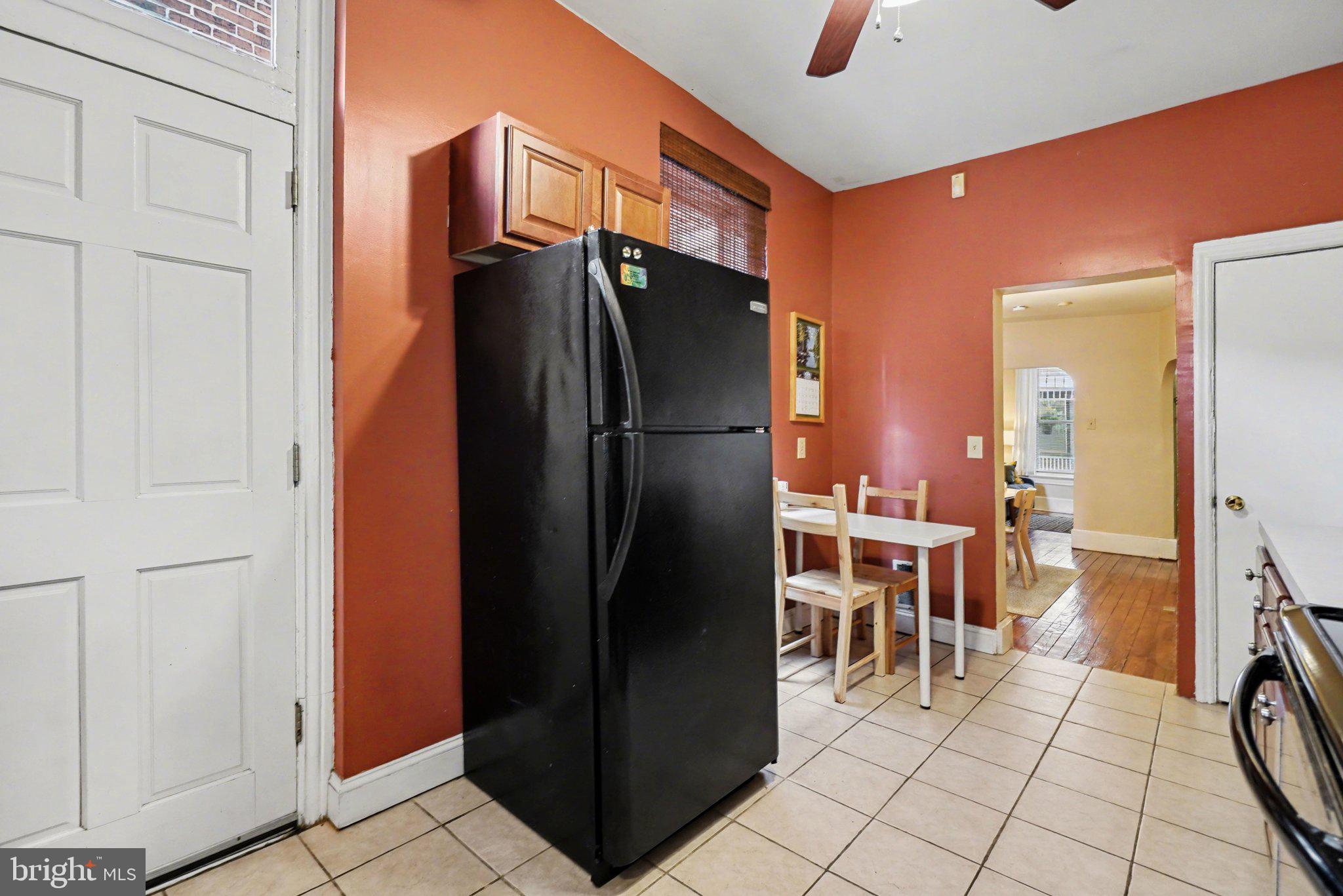 261 Delaware Street Harrisburg, PA 17102 - Photo 12 of 40 a kitchen with stainless steel appliances a refrigerator and a stove