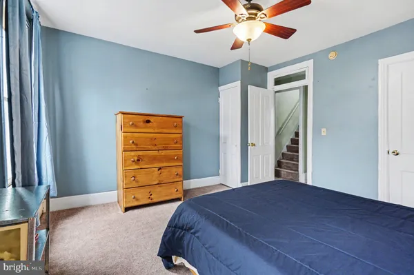 a bedroom with a bed and cabinets