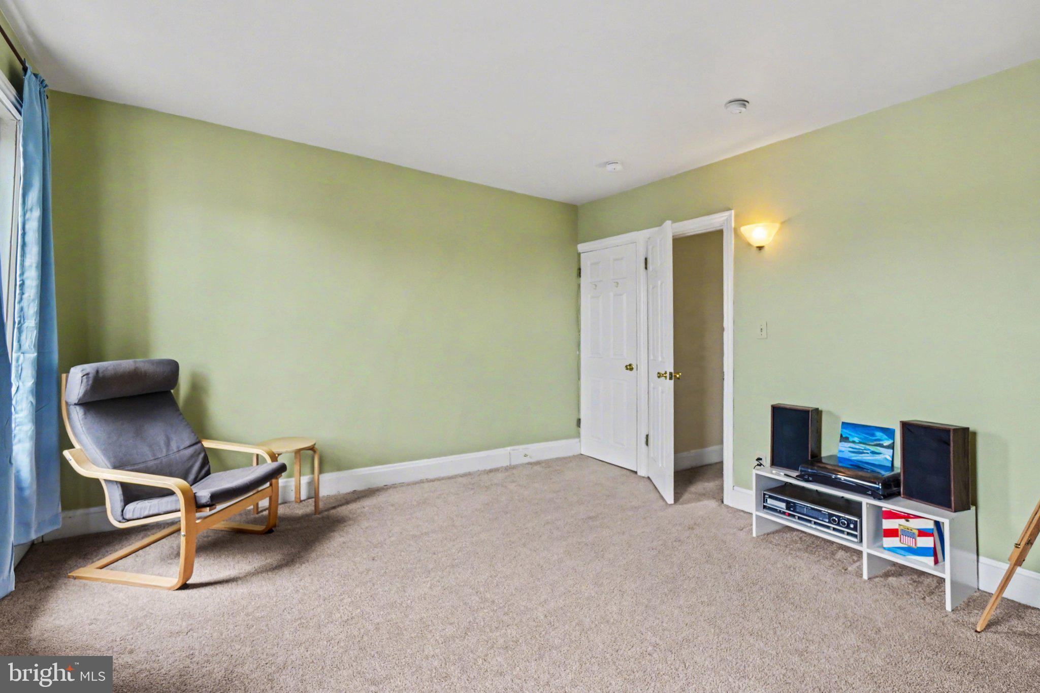 261 Delaware Street Harrisburg, PA 17102 - Photo 19 of 40 a living room with furniture and a flat screen tv