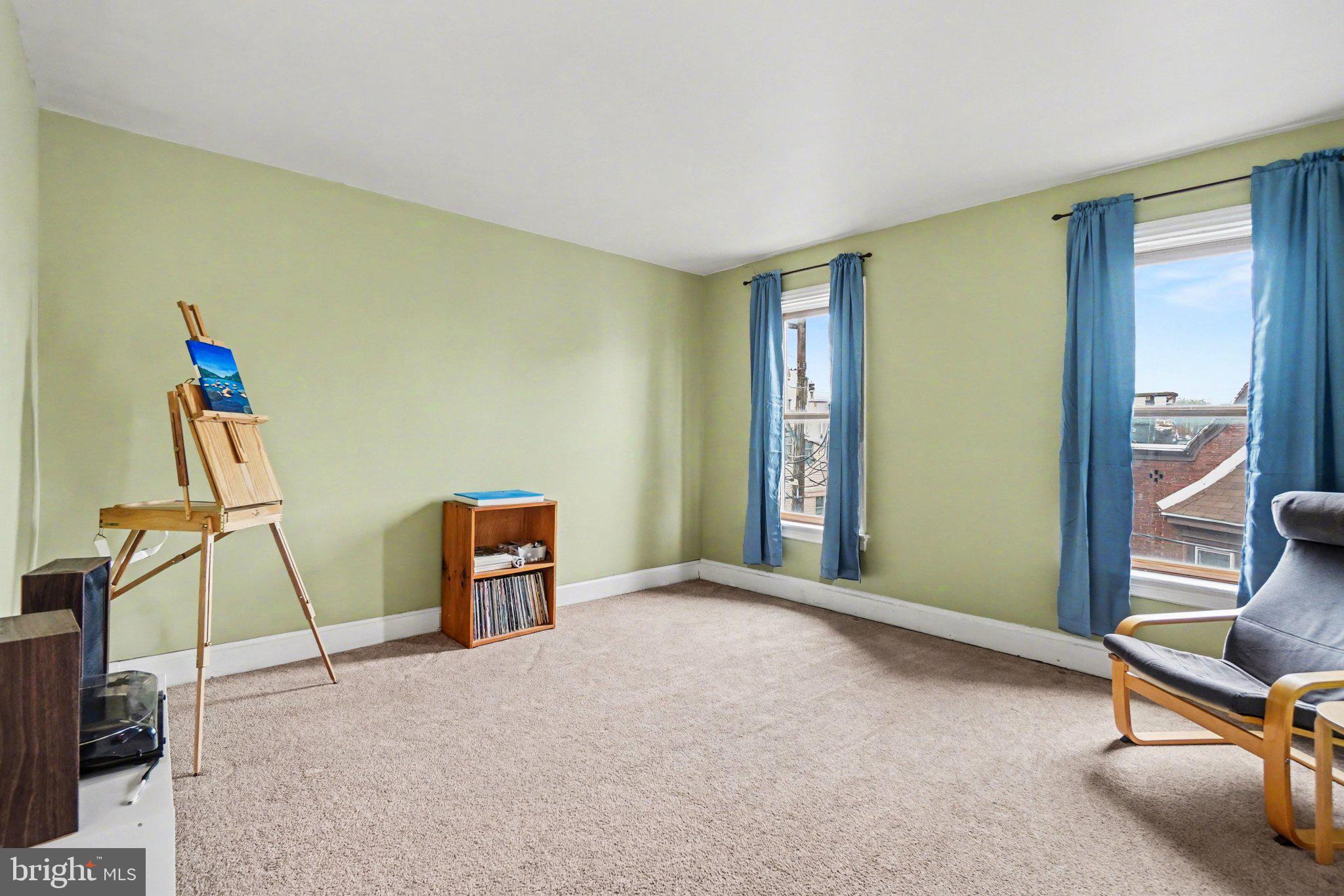 261 Delaware Street Harrisburg, PA 17102 - Photo 20 of 40 a view of an empty room with furniture and a window