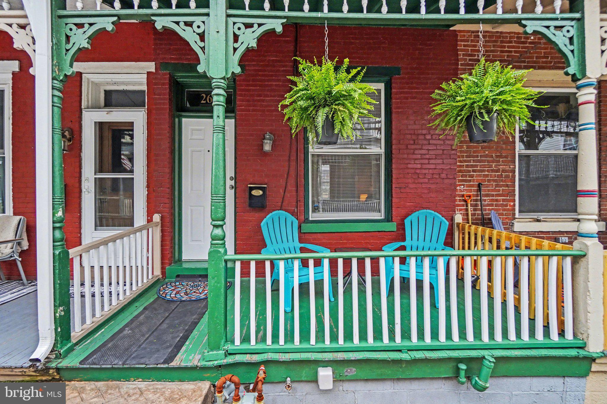 261 Delaware Street Harrisburg, PA 17102 - Photo 29 of 40 a view of a house with a small yard and flower plants