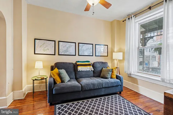 a living room with furniture and a window