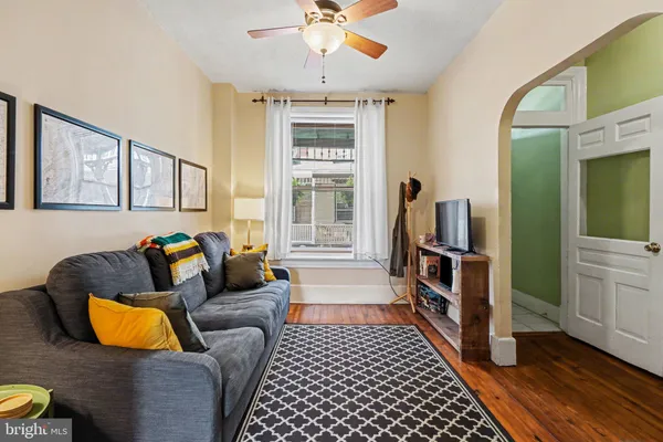 a living room with furniture and a rug