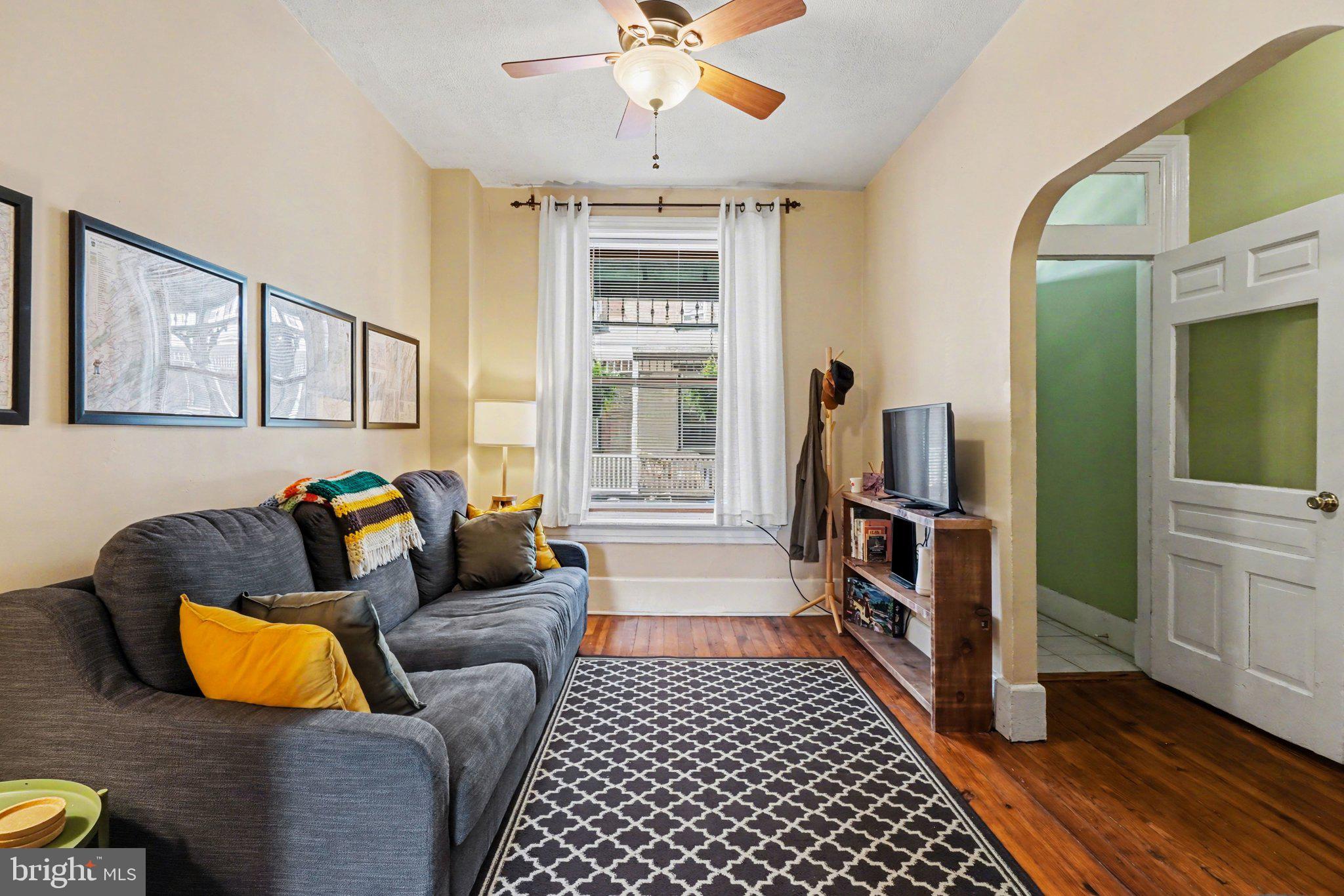 261 Delaware Street Harrisburg, PA 17102 - Photo 4 of 40 a living room with furniture and a rug