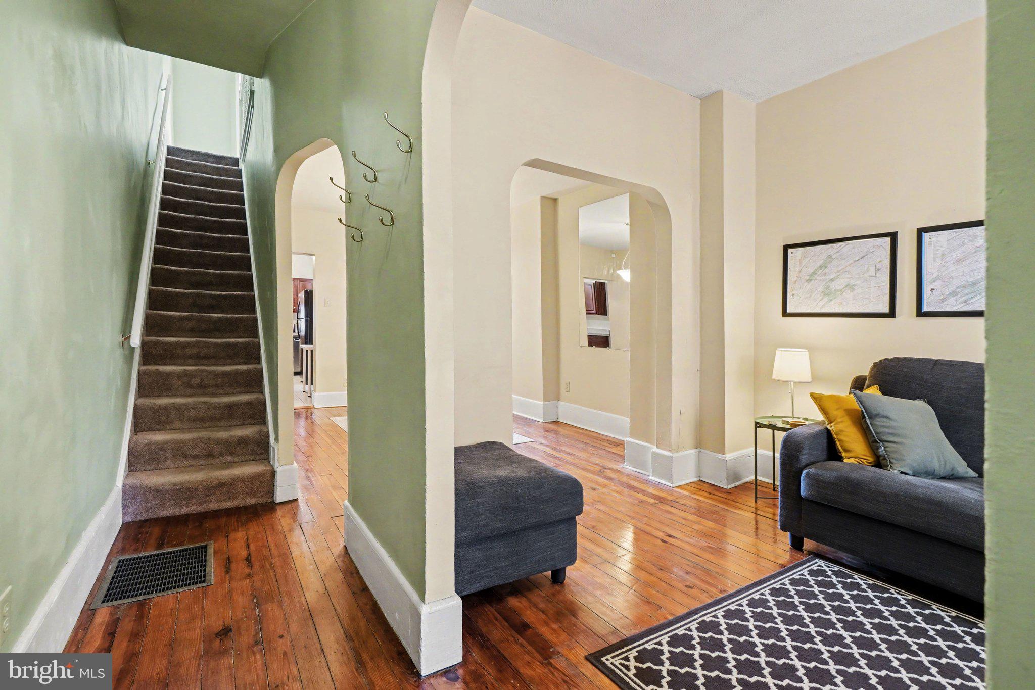 261 Delaware Street Harrisburg, PA 17102 - Photo 6 of 40 a living room with furniture and wooden floor