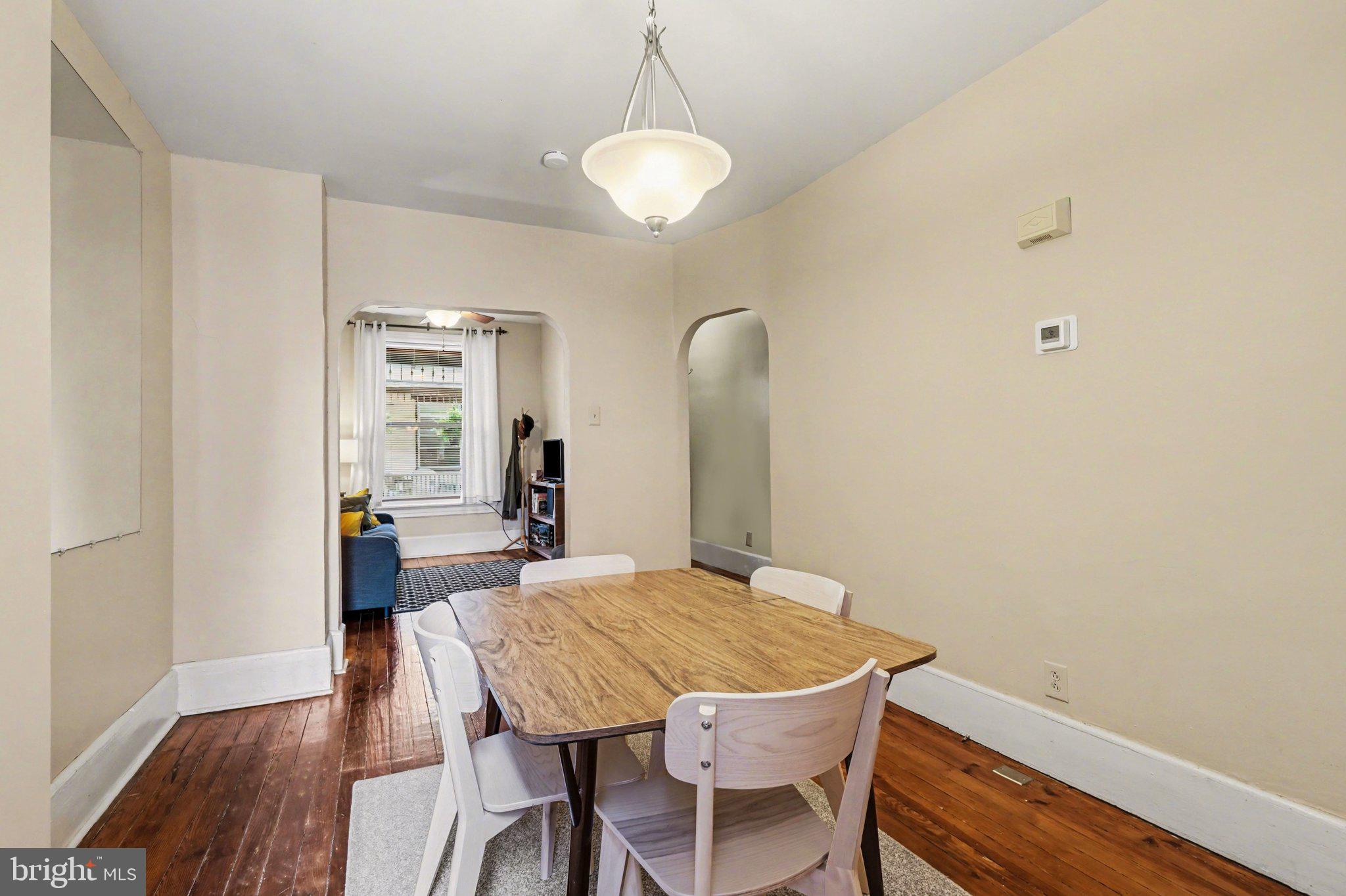 261 Delaware Street Harrisburg, PA 17102 - Photo 7 of 40 a view of a dining room with furniture and wooden floor