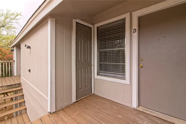 a view of wooden floor and windows in a room