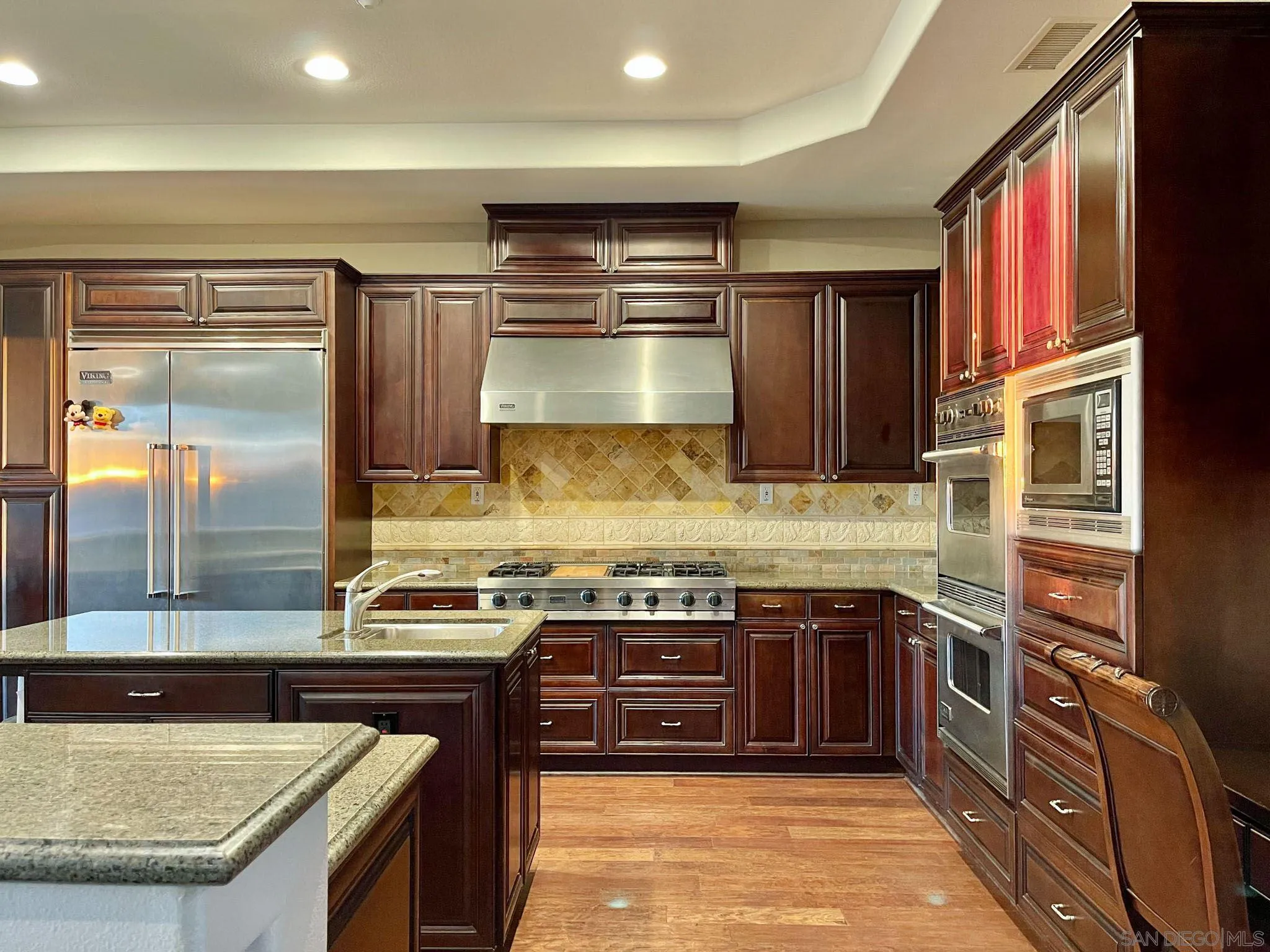 694 Cypress Hills Drive Encinitas, CA 92024 - Photo 15 of 49 a kitchen with stainless steel appliances granite countertop a stove and a sink