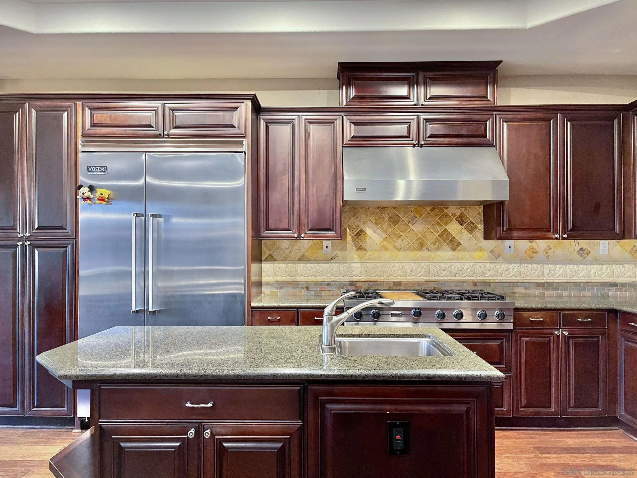 694 Cypress Hills Drive Encinitas, CA 92024 - Photo 18 of 49 a kitchen with granite countertop a sink a stove and refrigerator