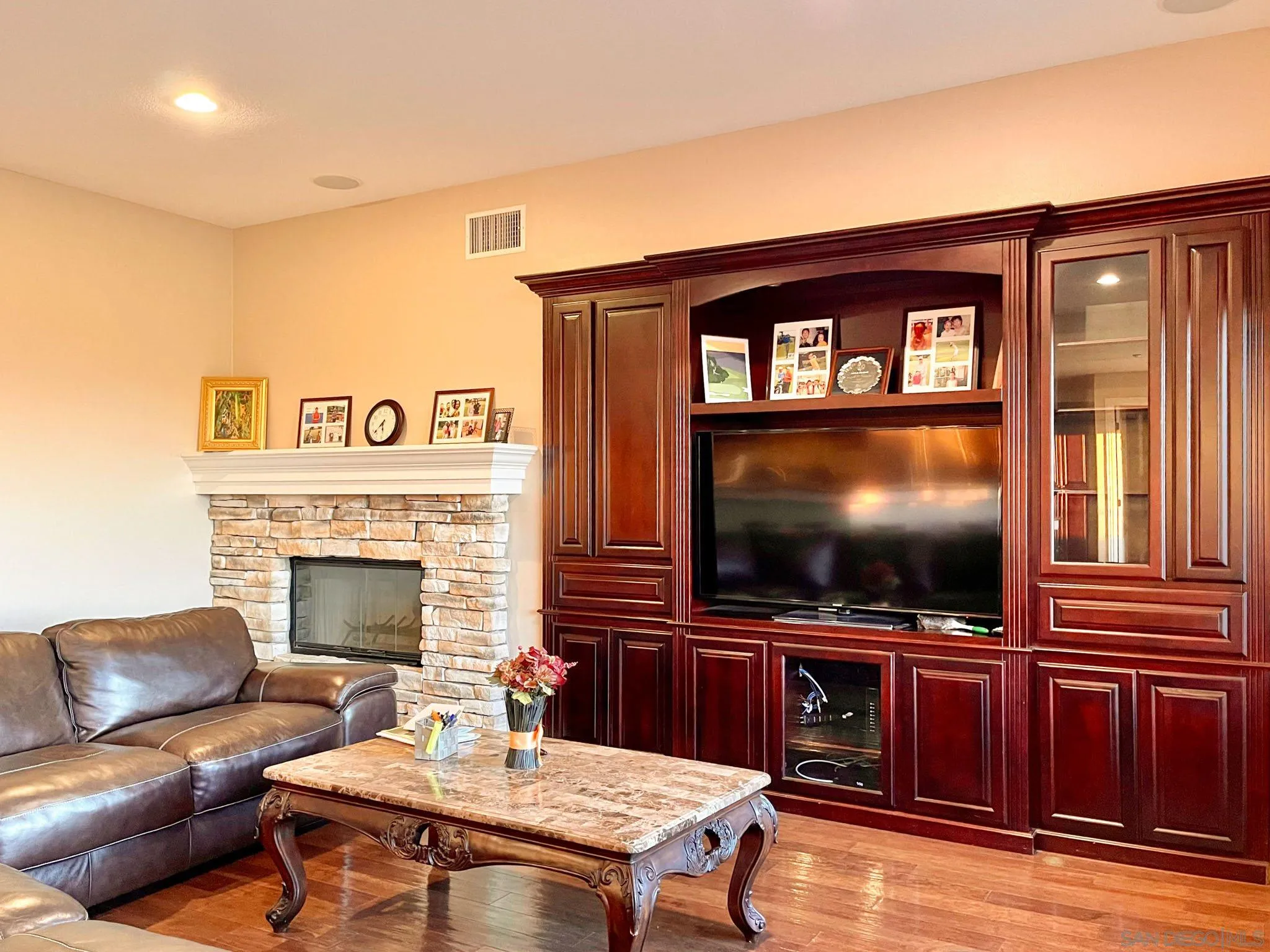 694 Cypress Hills Drive Encinitas, CA 92024 - Photo 22 of 49 a living room with furniture and a flat screen tv