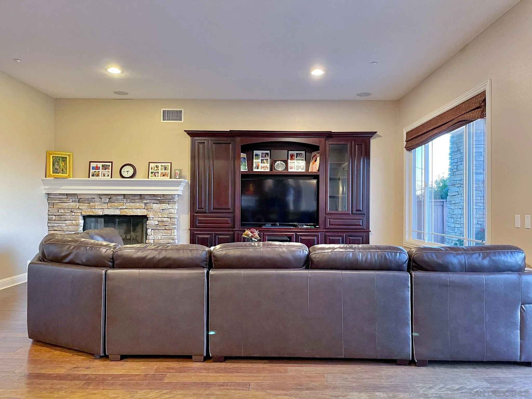 694 Cypress Hills Drive Encinitas, CA 92024 - Photo 23 of 49 a living room with furniture and a fireplace