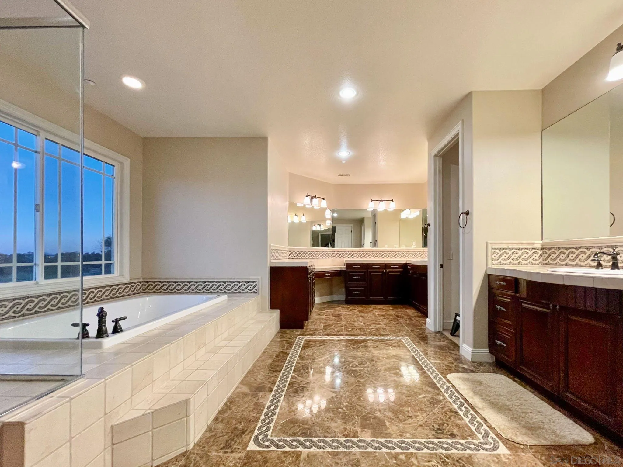 694 Cypress Hills Drive Encinitas, CA 92024 - Photo 31 of 49 a large white kitchen with a large window