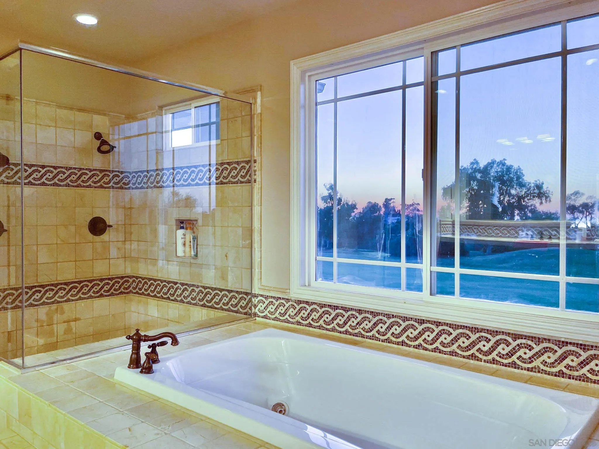 694 Cypress Hills Drive Encinitas, CA 92024 - Photo 33 of 49 a bathroom with a tub and a shower