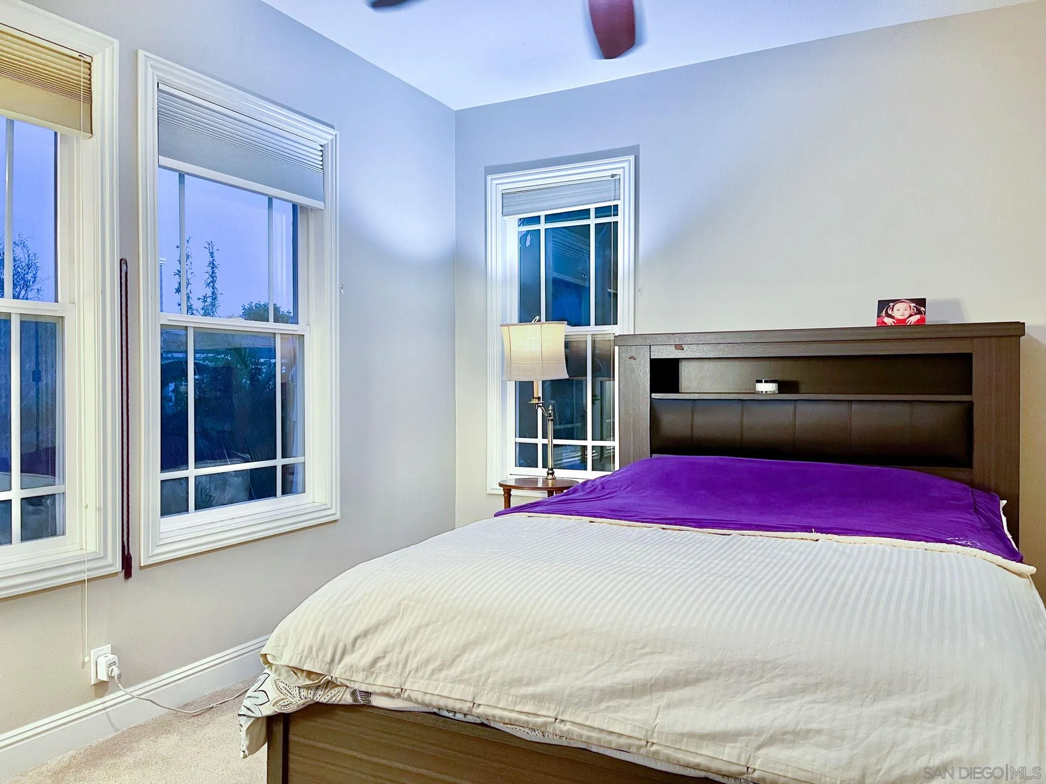 694 Cypress Hills Drive Encinitas, CA 92024 - Photo 36 of 49 a bedroom with a bed and a window